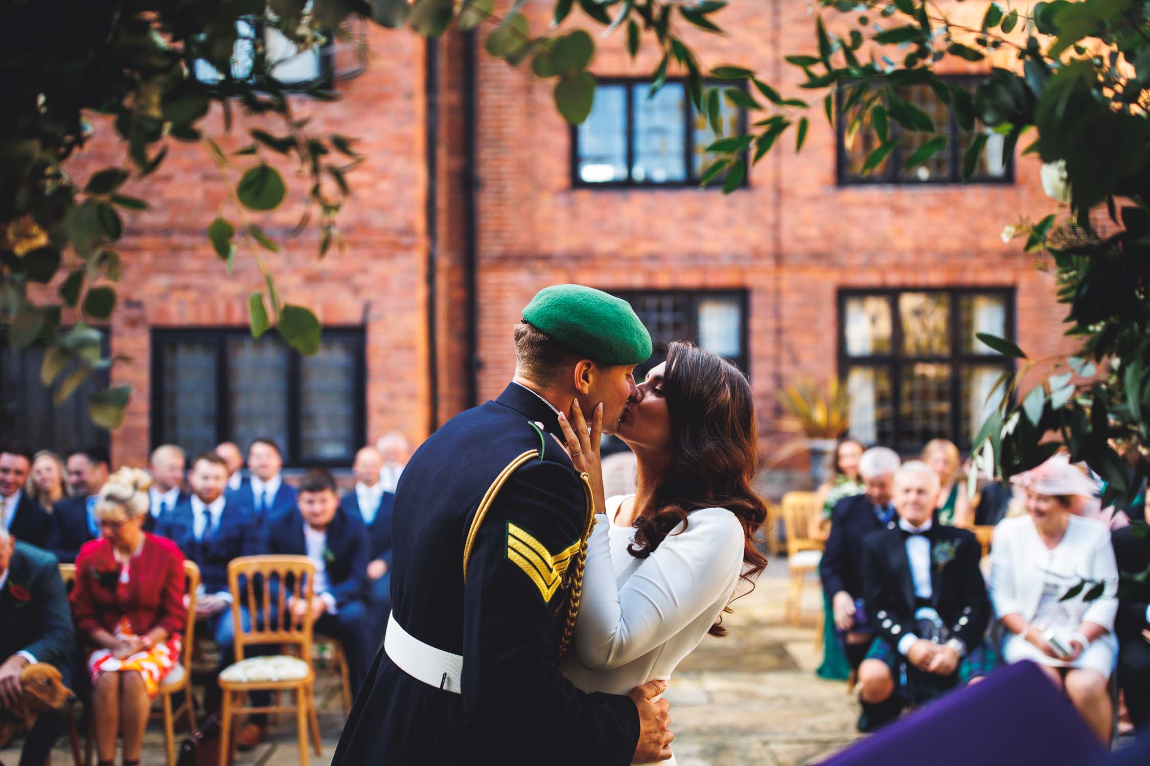 First kiss of bride and groom at Brinsop Court in Herefordshire.