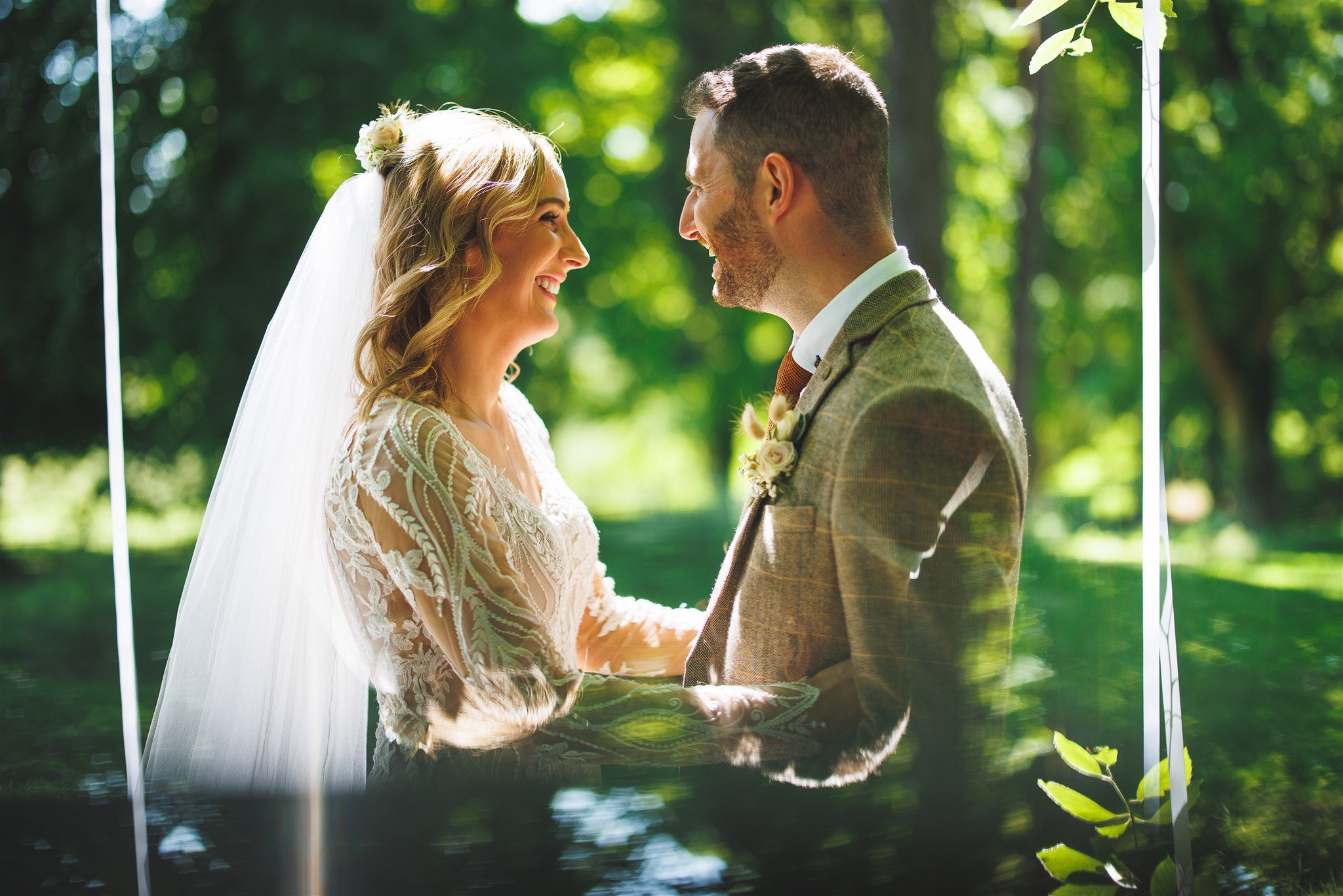Amy and Phil together beneath her veil