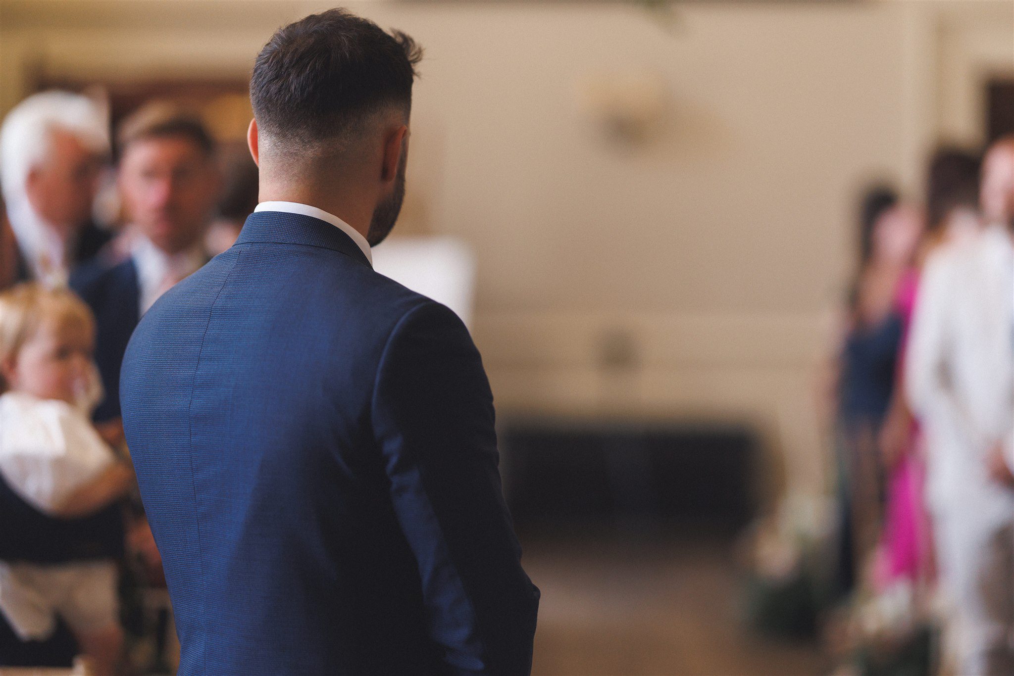 Guests throwing confetti over Zofia and Ben at Elmore Court