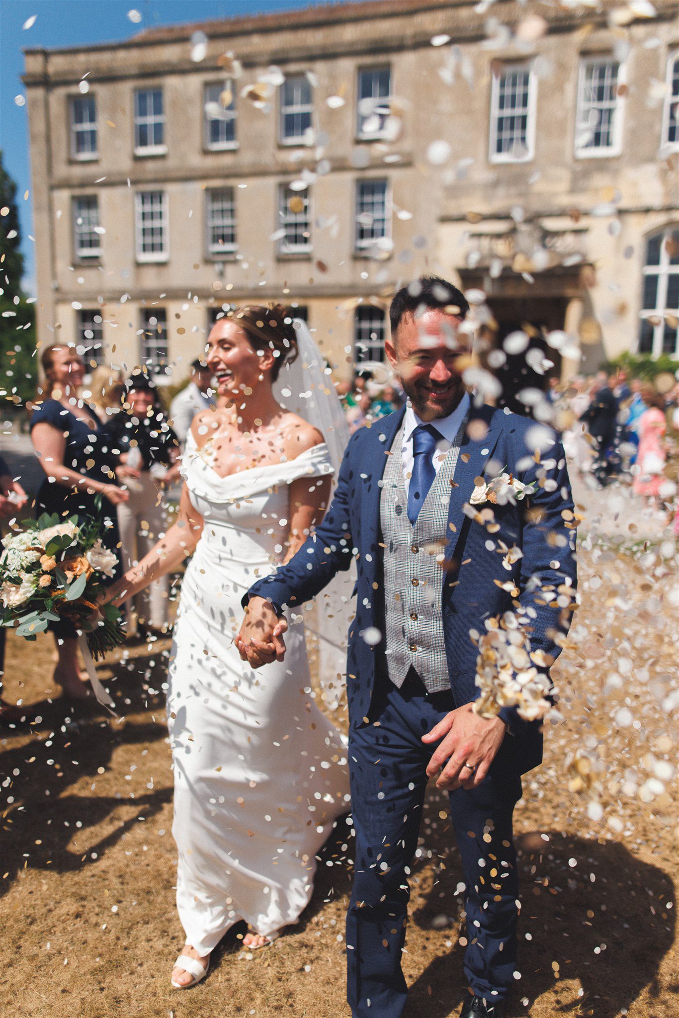 Confetti thrown over Zofia and Ben outside Elmore Court
