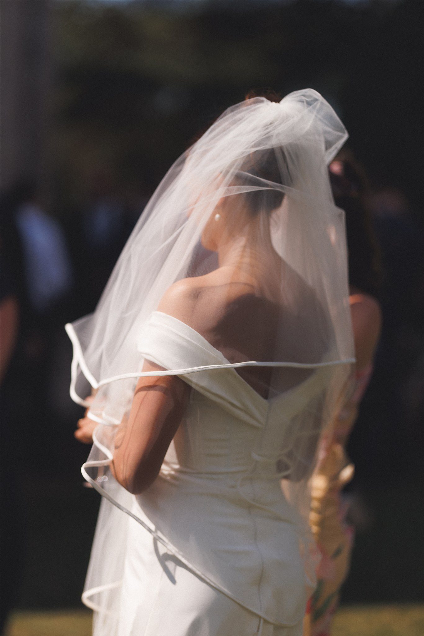 Zofia with her veil drawn across her shoulder at Elmore Court