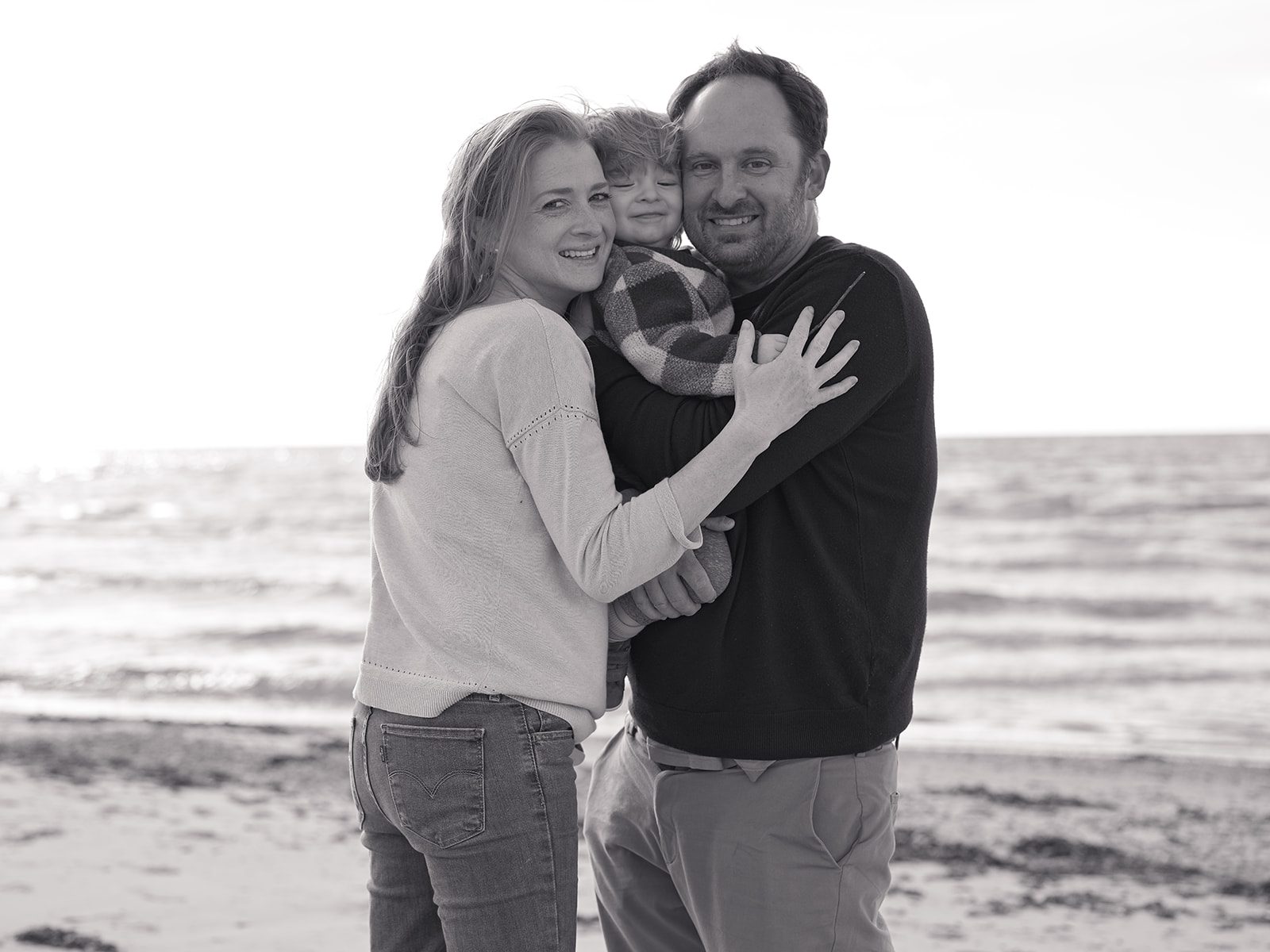 David Liebst with his wife Sarah and their son Finley on a beach