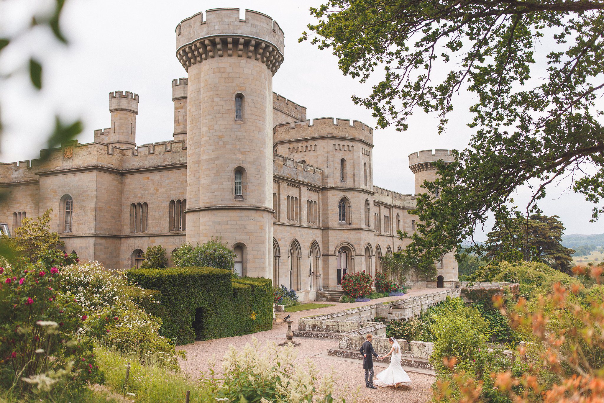 Eastnor Castle and its gardens with Lucinda and Tom on the terrace
