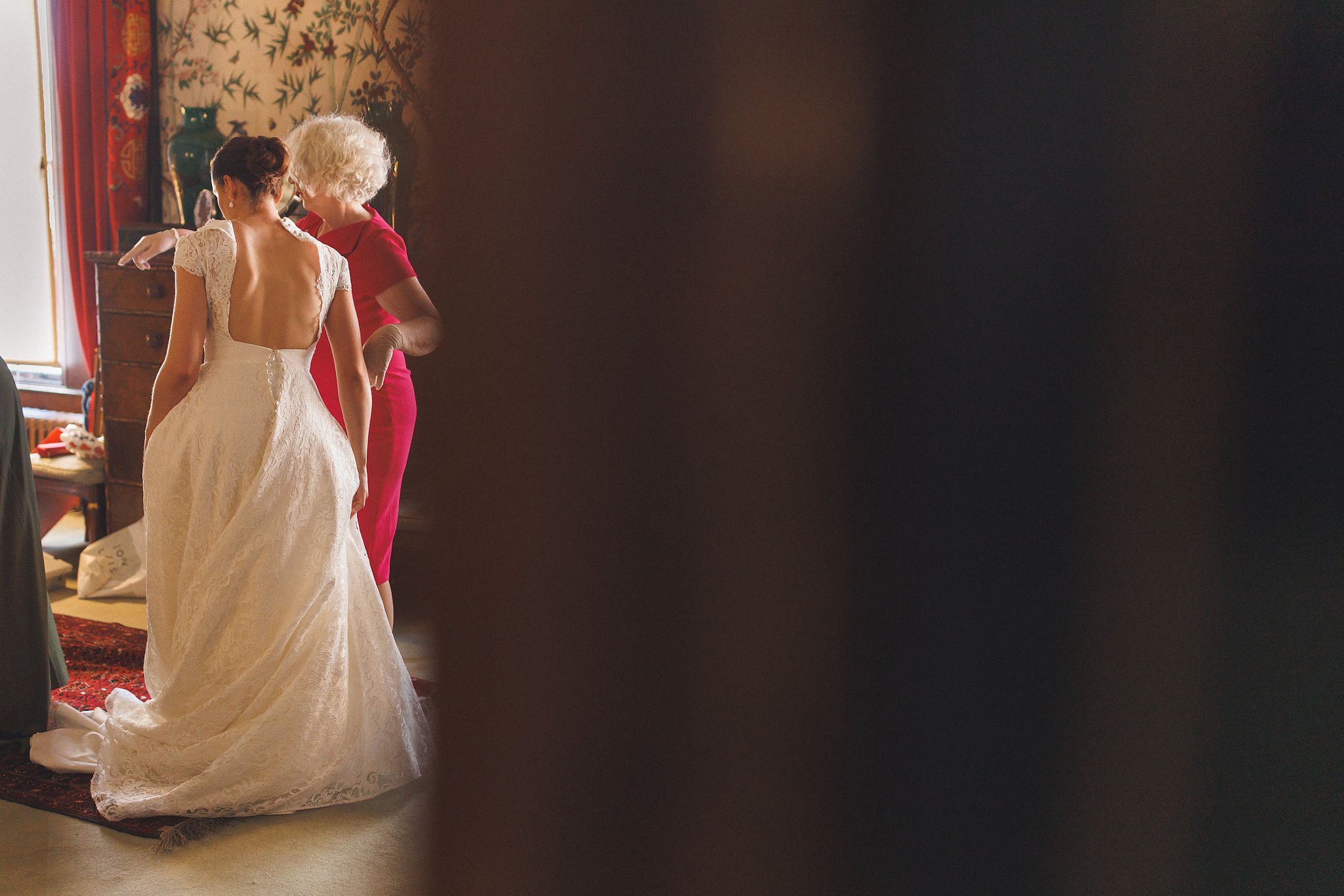 Lucinda being helped into her dress