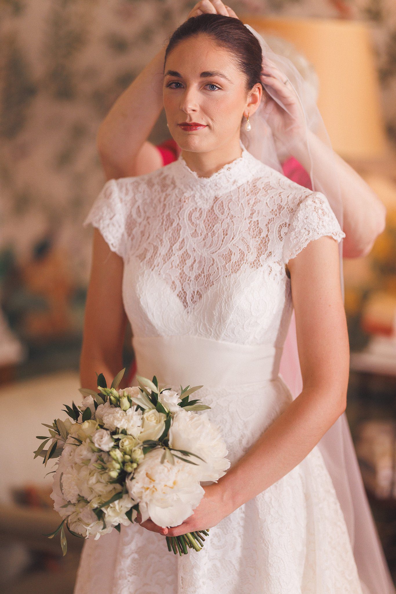 Lucinda in her lace dress with her bouquet