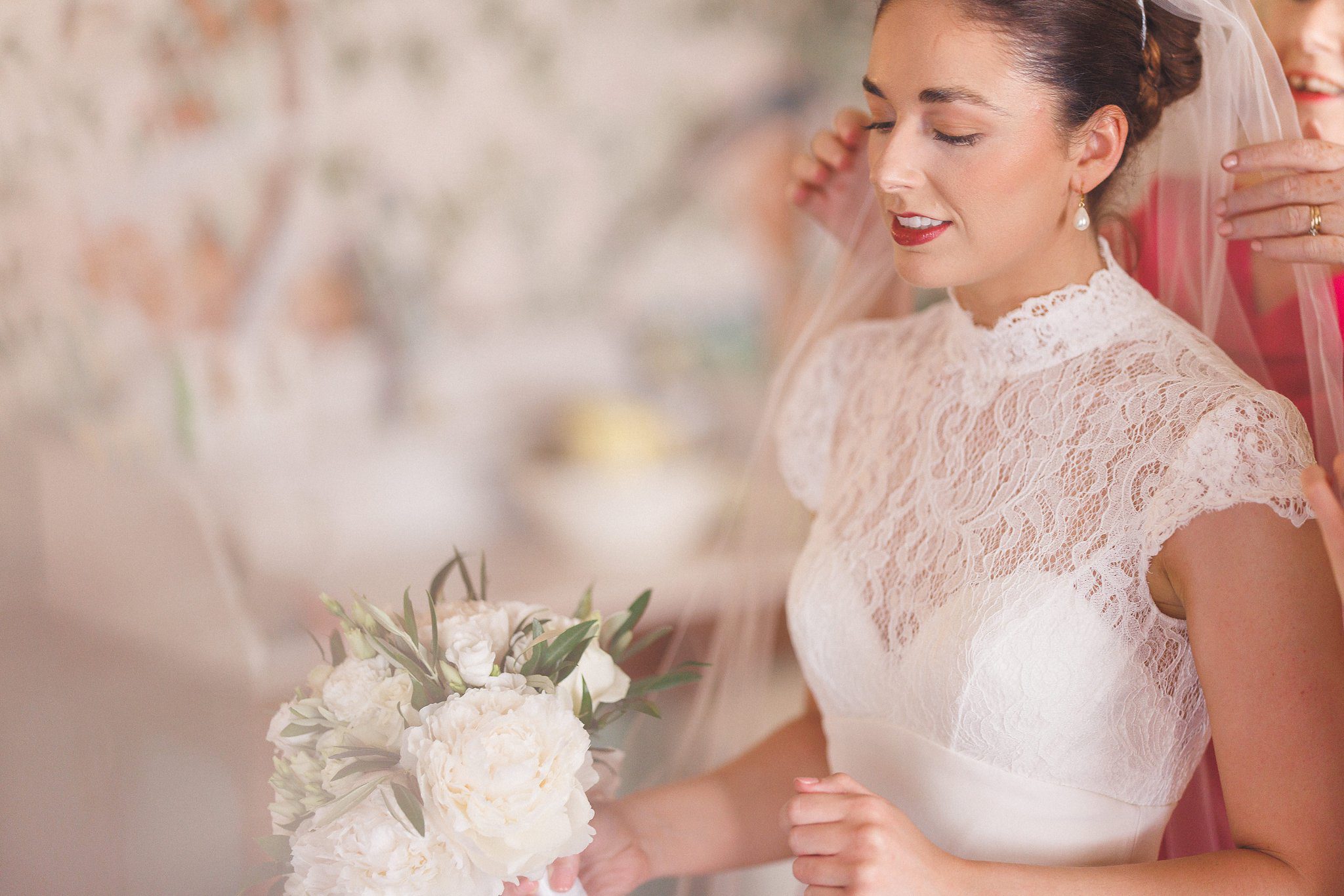 The veil being pinned into Lucinda’s hair