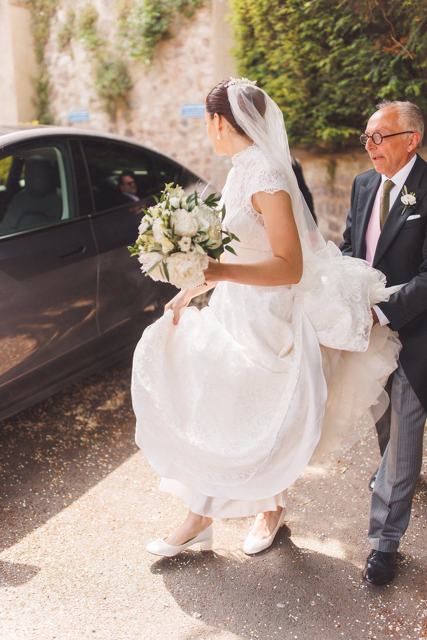 Lucinda getting out of the car with her father