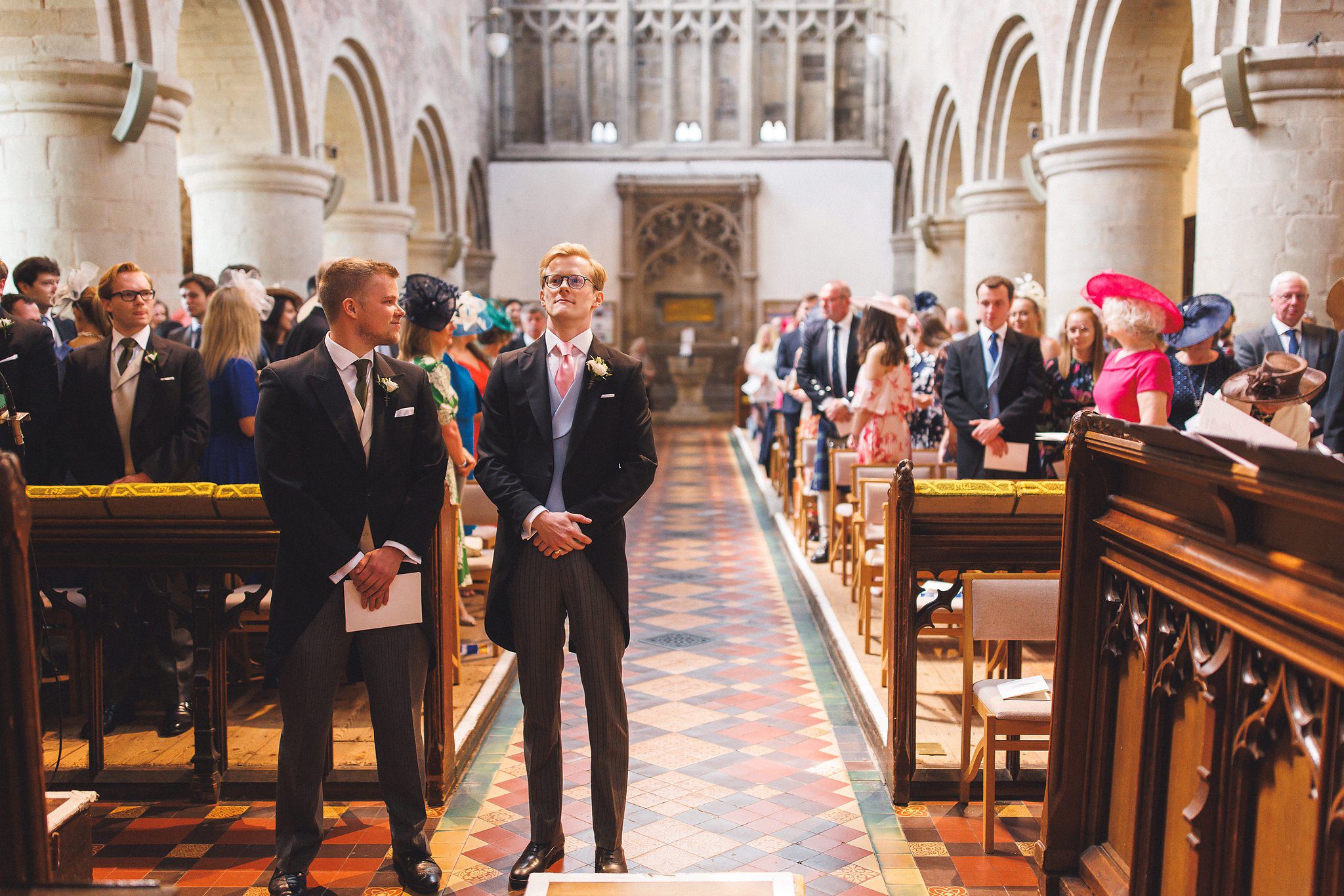 Tom and his best man waiting at the front of the priory