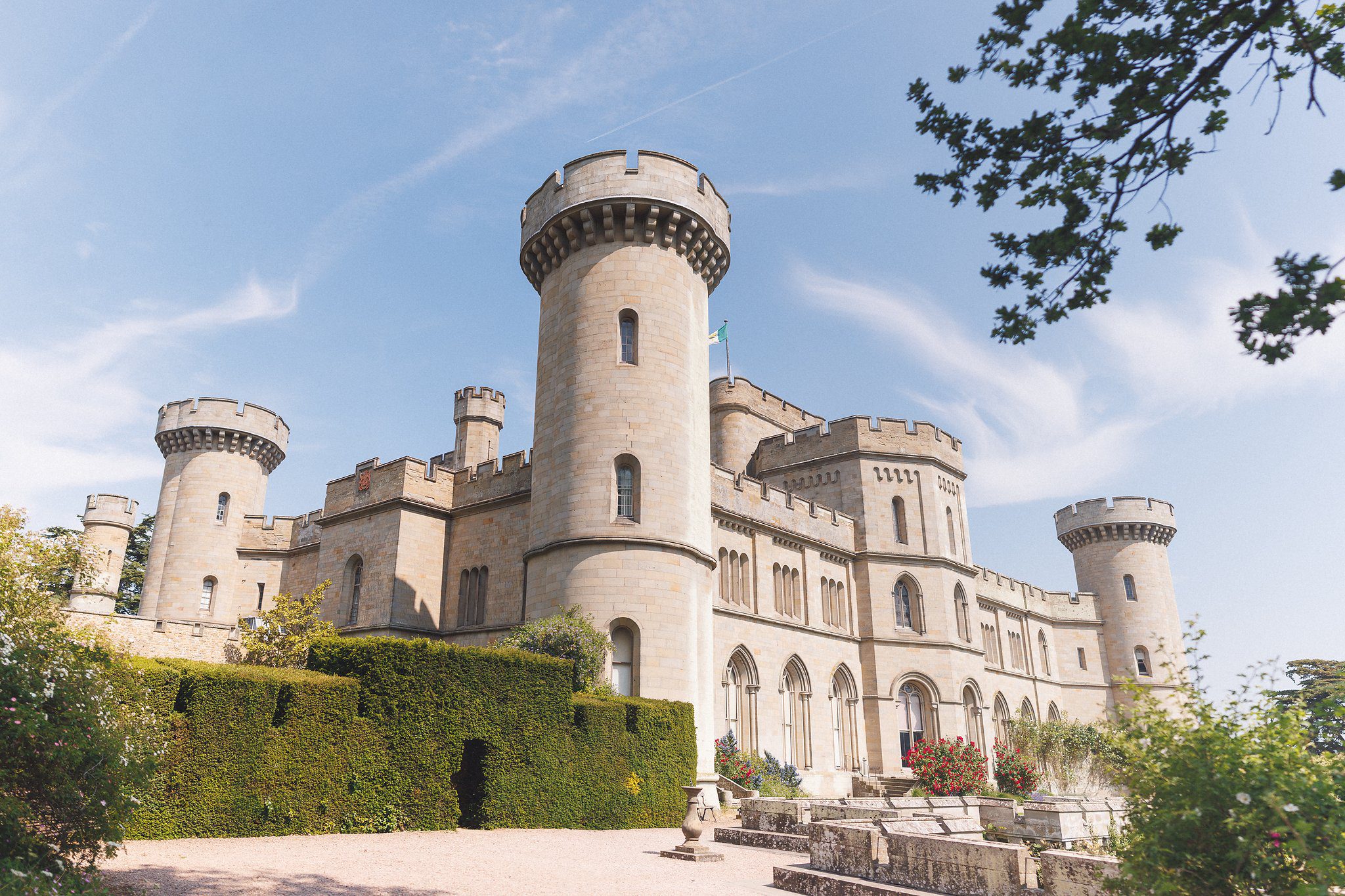 The towers of Eastnor Castle above the gardens