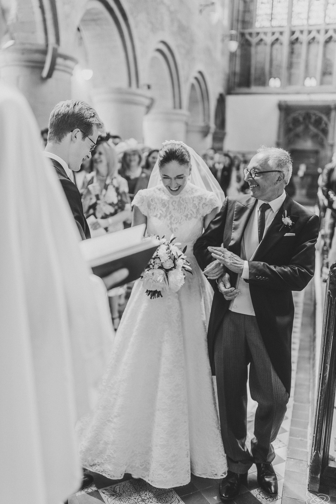 Lucinda and her father at the front of the priory, in black and white