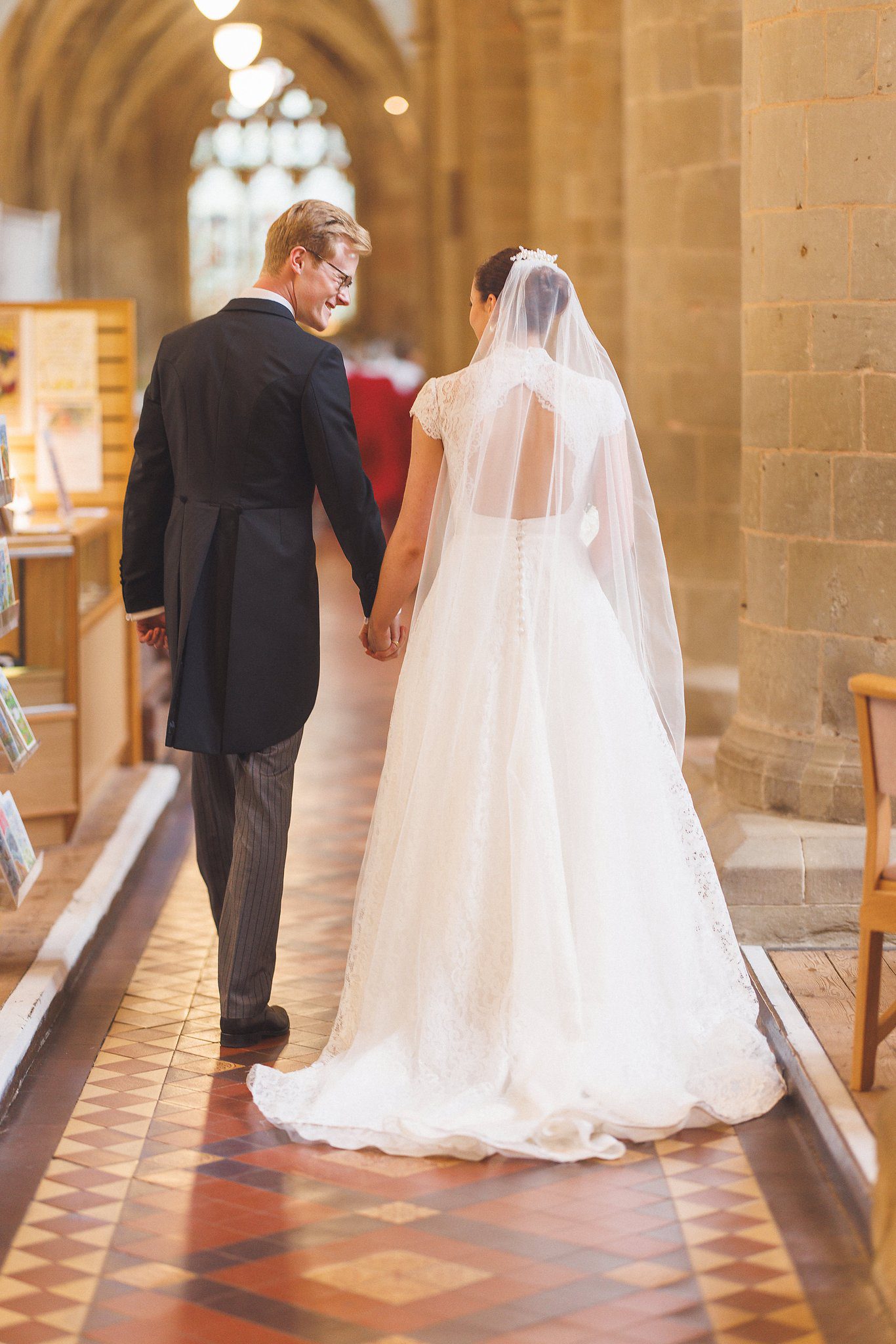 Lucinda and Tom walking back down the aisle