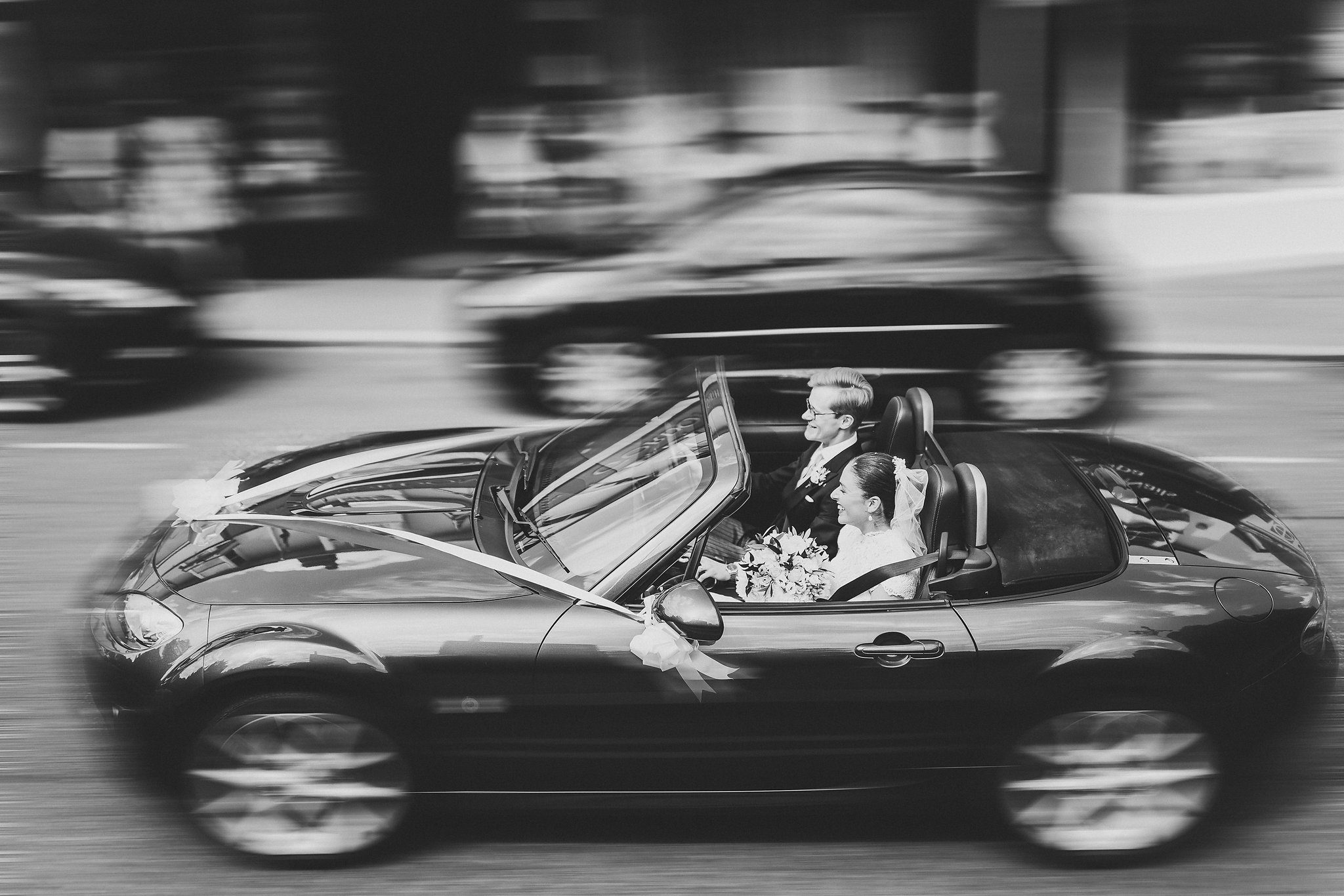 Lucinda and Tom driving back to Eastnor, in black and white