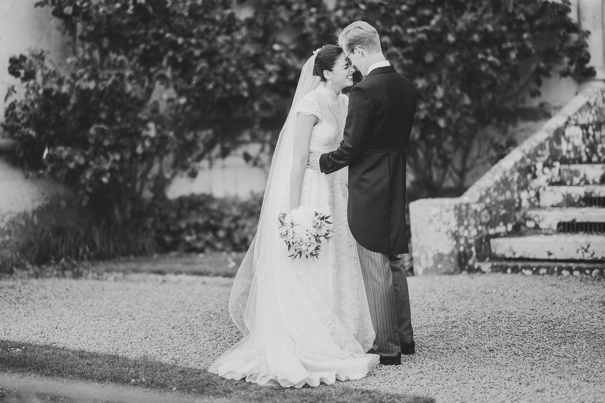 Lucinda and Tom on the steps, in black and white