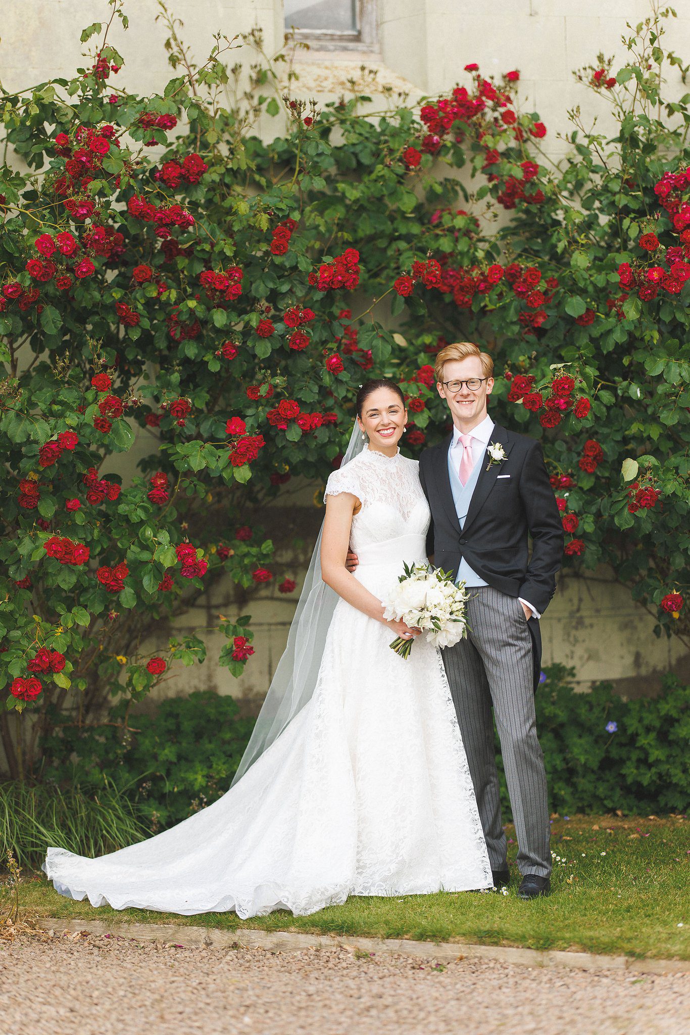 Lucinda and Tom beside the roses at Eastnor Castle