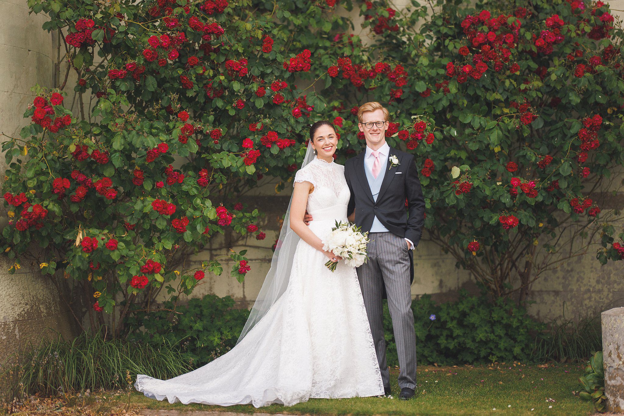 Lucinda and Tom against the rose-covered wall