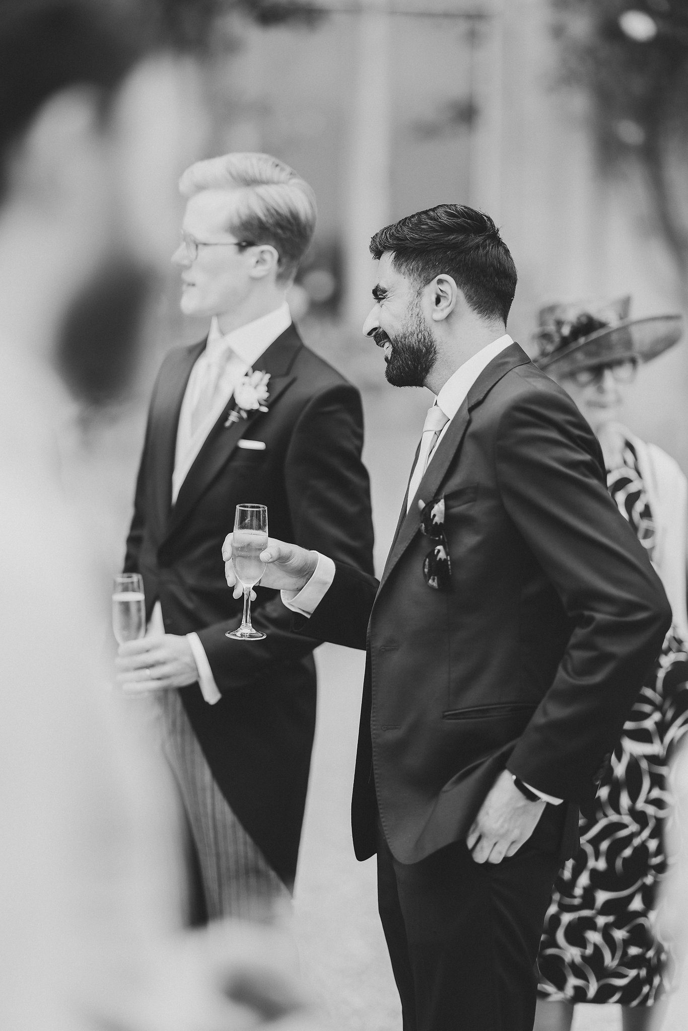 Guests during the drinks reception, in black and white