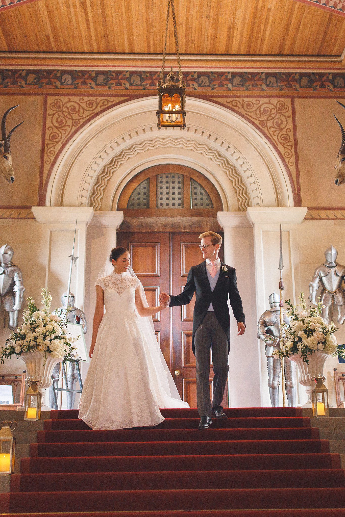 Lucinda and Tom at the top of the stairs in the great hall