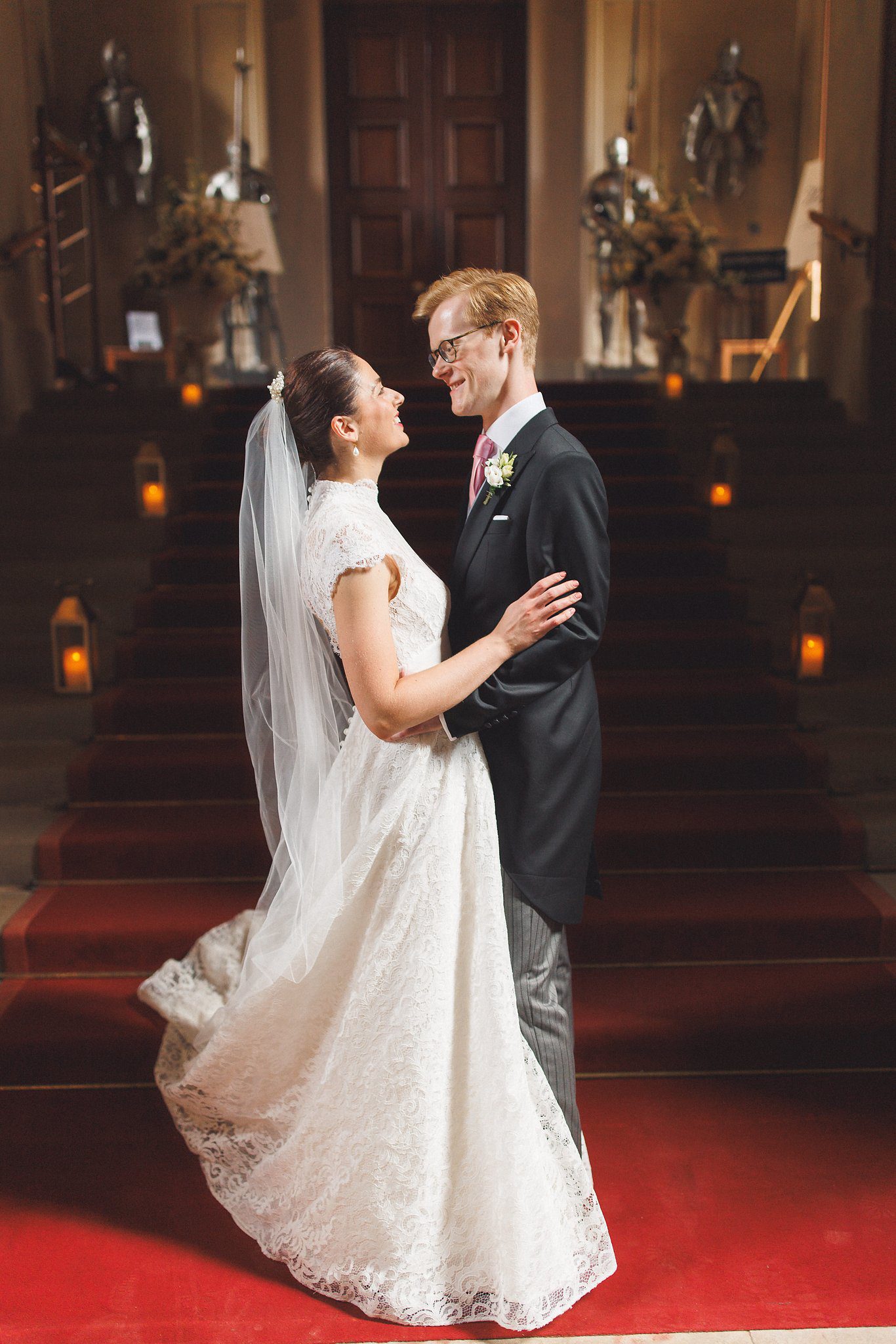 Lucinda and Tom on the red staircase at Eastnor Castle