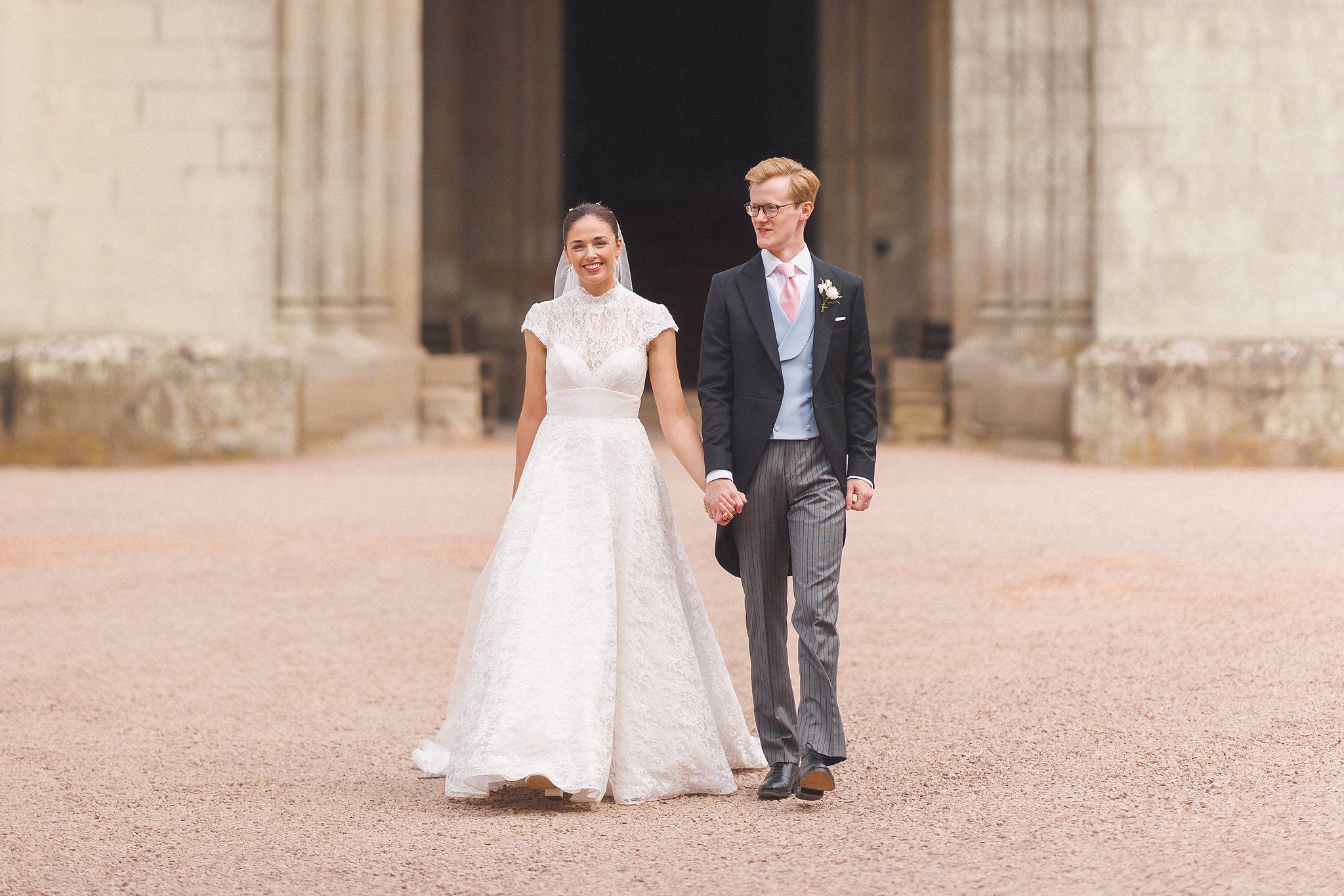 Lucinda and Tom walking across the castle forecourt