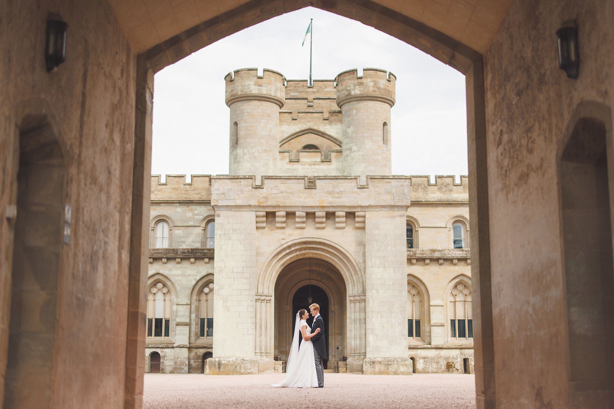 Lucinda and Tom framed by the gatehouse arch