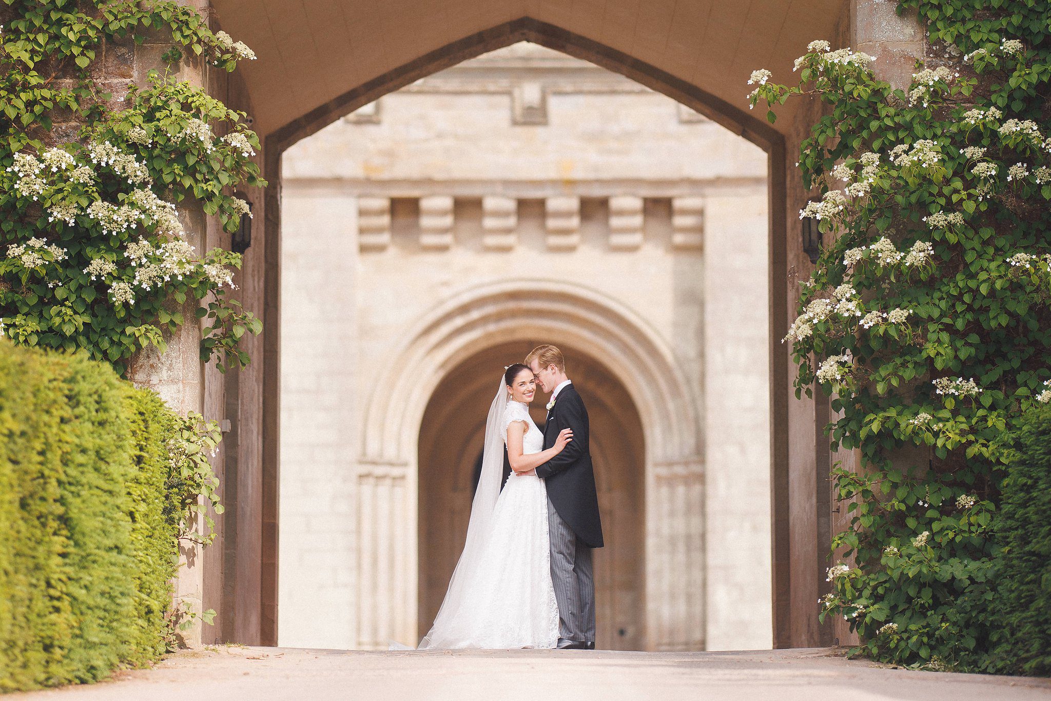 Lucinda and Tom in the archway in the castle gardens