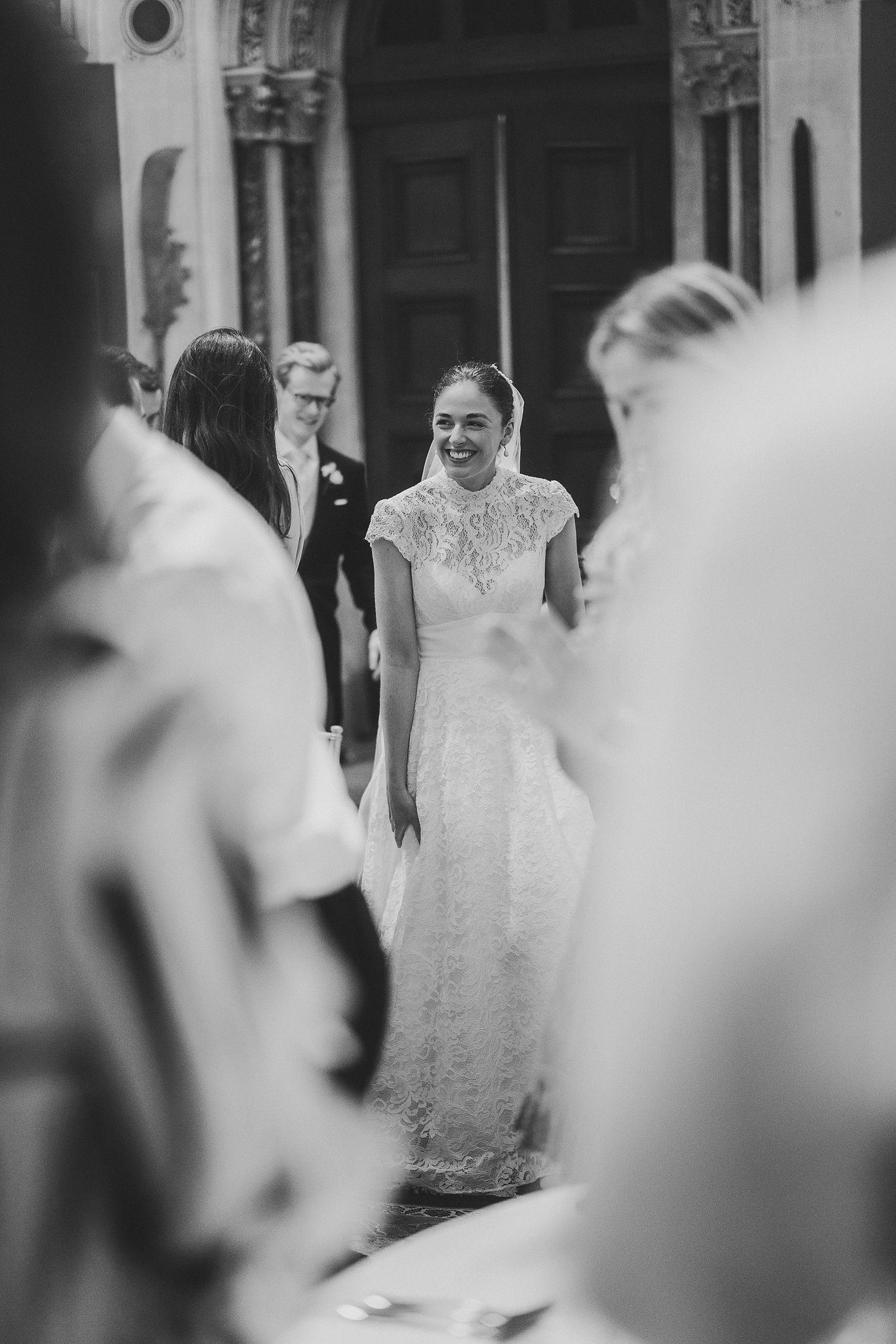 Lucinda seen through the crowd, in black and white