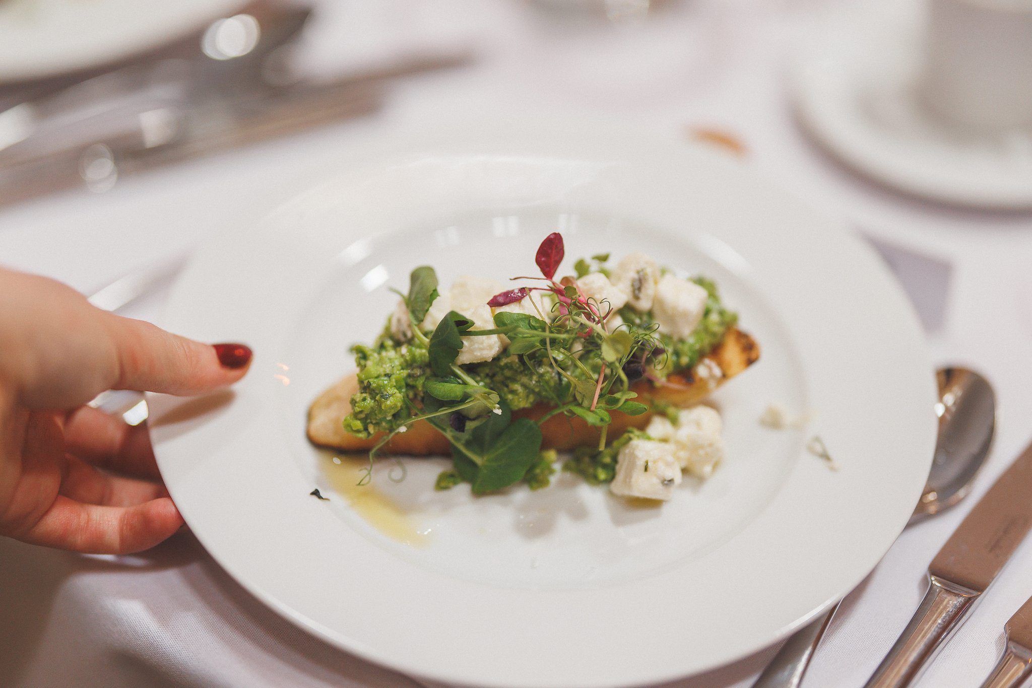 A plate being carried in during the wedding breakfast