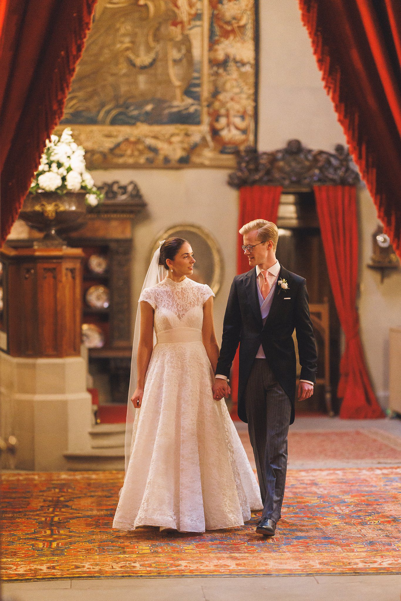 Lucinda and Tom walking through the castle
