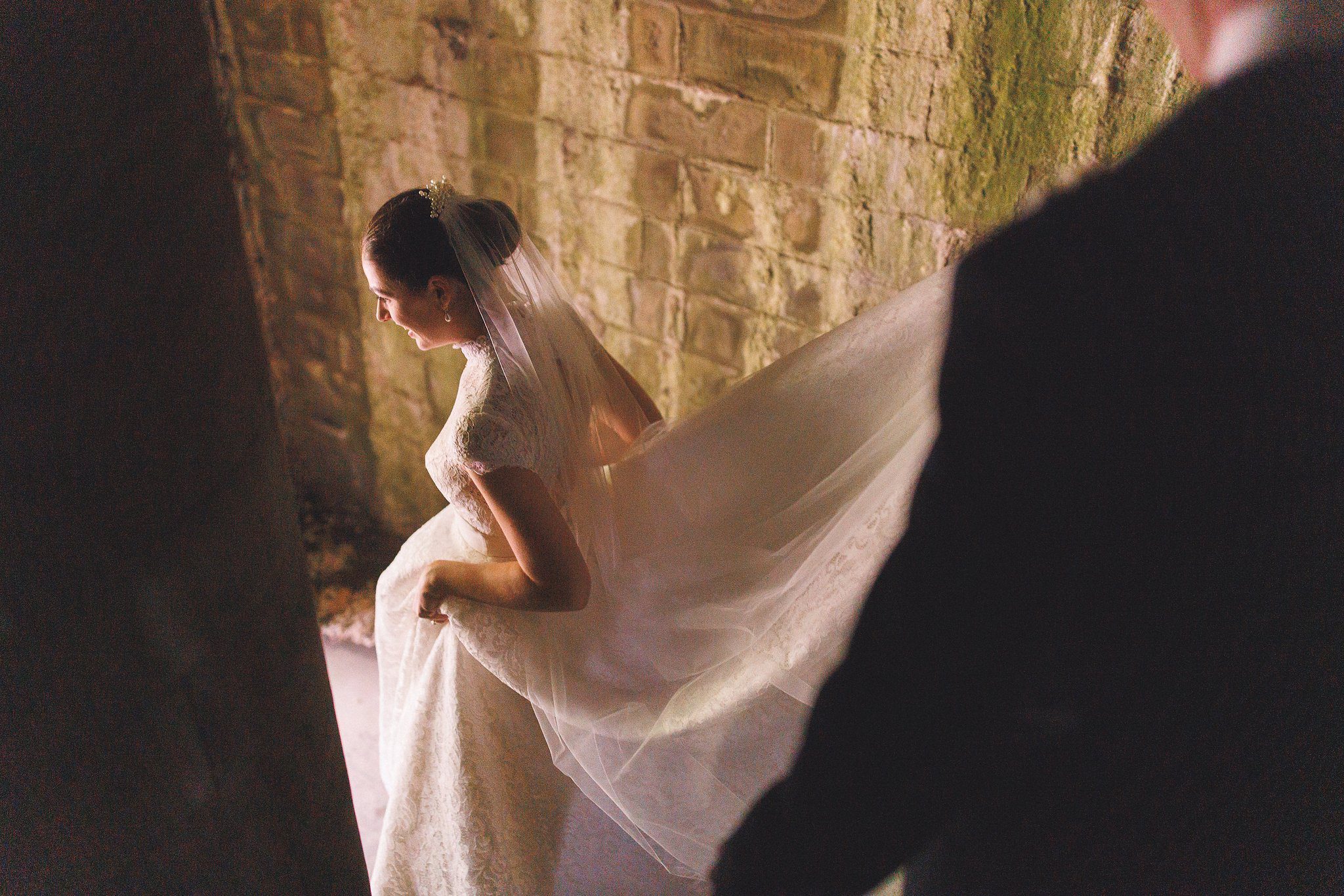 Lucinda’s veil caught in the light of the castle wall